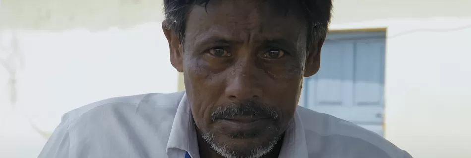 Picture shows a person looking straight into the camera